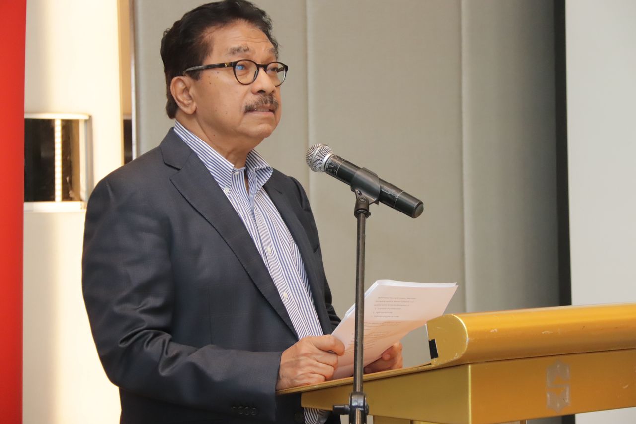 MIDF Group Chairman Tan Sri Rahman Mamat giving a speech